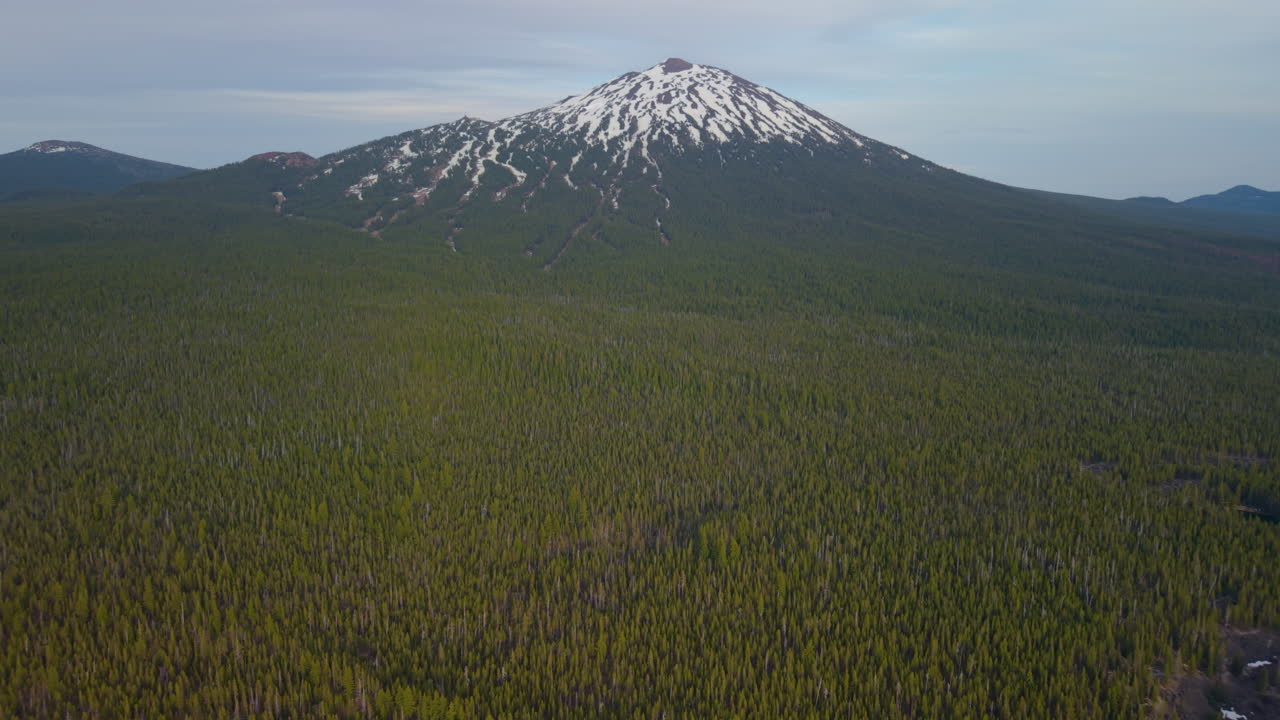 Panoramic drone view of Mount Bachelor near Bend Oregon. Flying over forest and wilderness area.