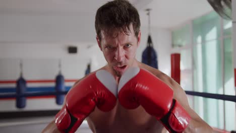 angry caucasian man in boxing ring