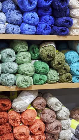 woolen threads of different colors in the store on the shelf woolen threads of different colors in the store on the shelf