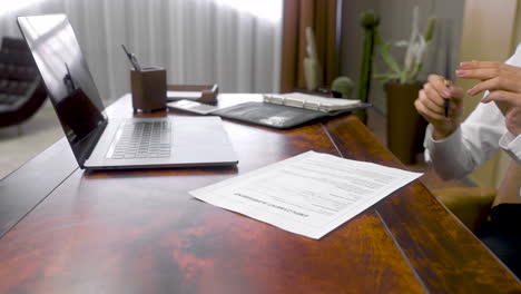 Close-Up-Of-Unrecognizable-Employee-And-Boss-Signing-The-Employment-Agreement-At-The-Office