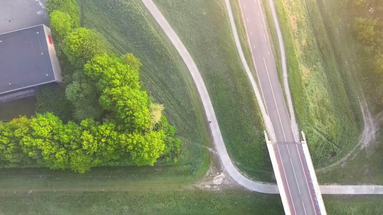 Aerial View of Urban Park and Road Network with Bridge and Buildings