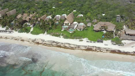 Papaya-Playa-Project-hotel-at-Tulum-with-forest-in-background,-Mexico