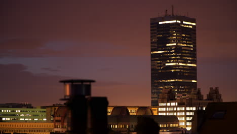 Timelapse-of-Clouds-Passing-Behind-Building-During-Blue-Hour