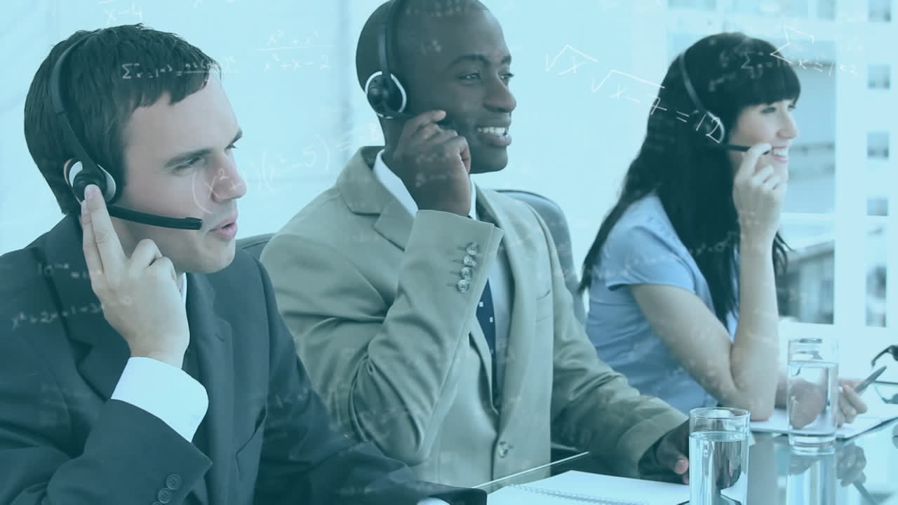 Mathematical equations floating over a multi-ethnic group of call centre workers