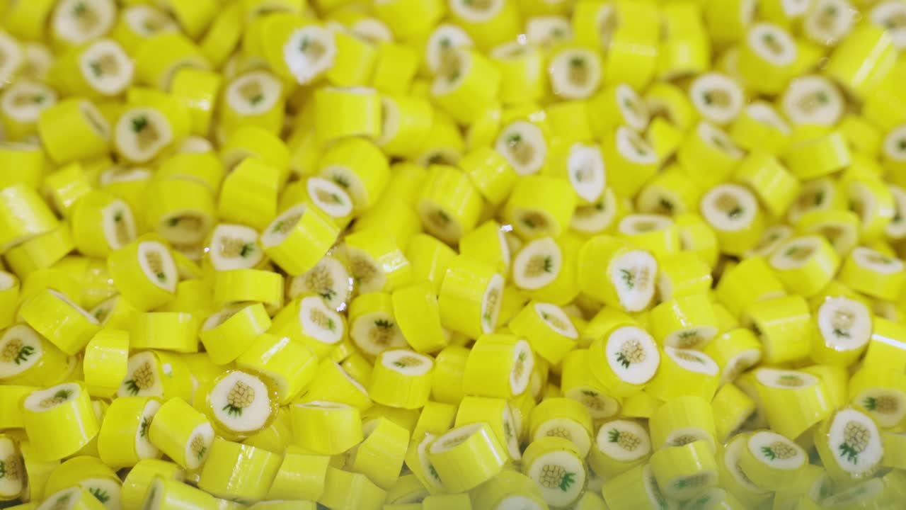 Yellow pineapple caramel candies in a pile