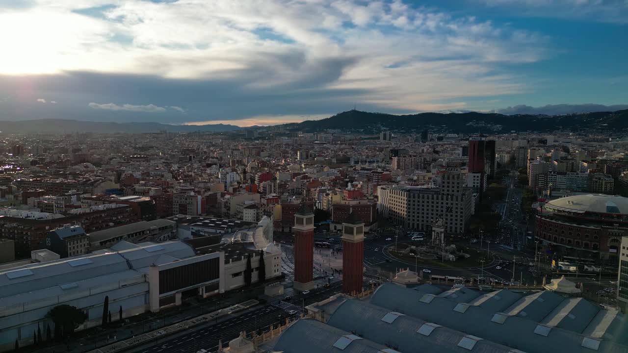 Barcelona skyline with mountains in the background, shot during daylight, aerial view