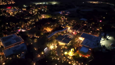 Night-aerial-at-Las-Noches-de-las-Luminarias,-Desert-Botanical-Garden,-Phoenix