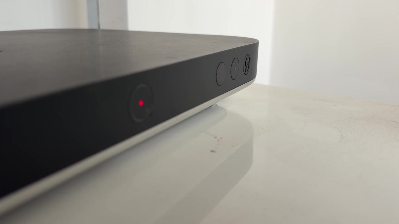 Digital TV Set Top Box with Red Standby Light on White Cabinet