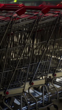 close-up of stacked shopping carts in a supermarket