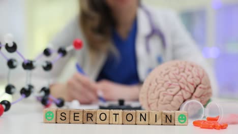 serotonin spelled on blocks with brain and molecular models in a lab setting