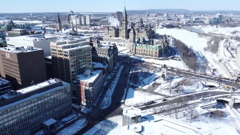 aerial forward view over city and its old cathedral with snow and its old cathedral