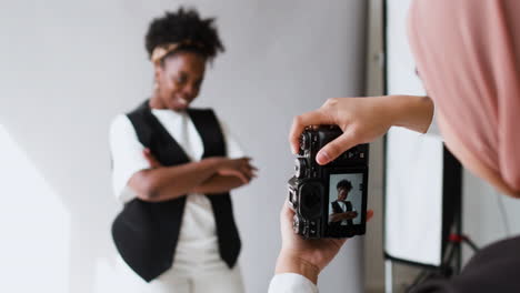 photographer taking pictures in studio