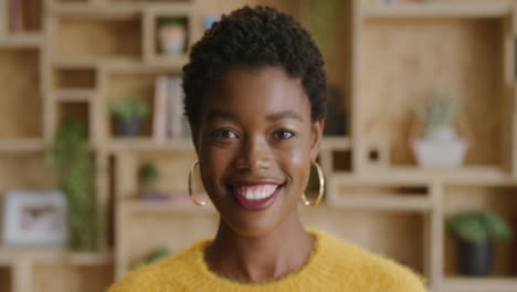 close up portrait of attractive african american business woman smiling enjoying lifestyle success wearing stylish fashion slow motion