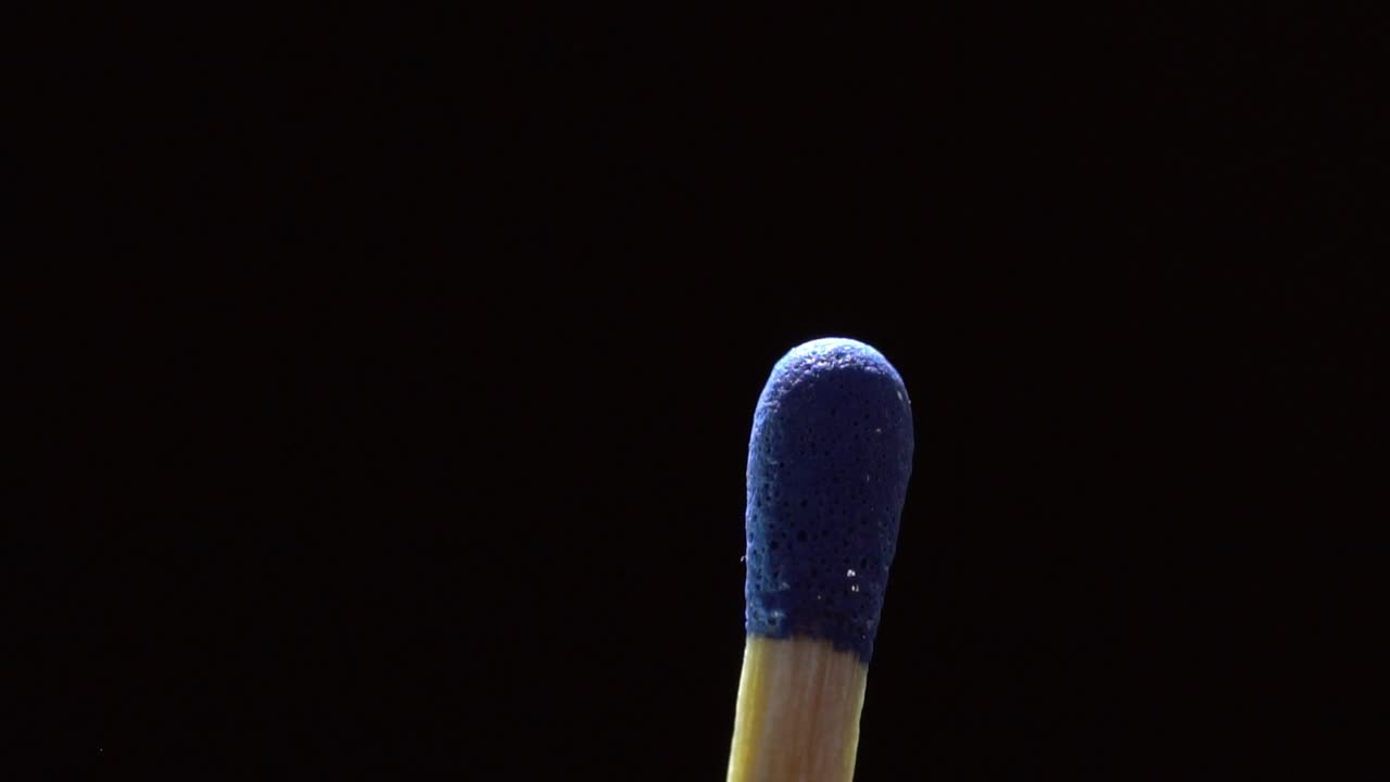Matchstick Head Against Black Background. - macros shot