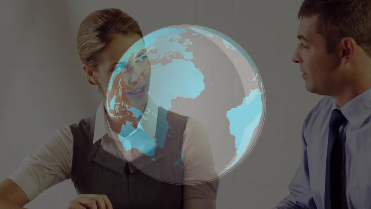 Female colleague tapping tablet activating 3D globe while gesturing chart data for market analysis