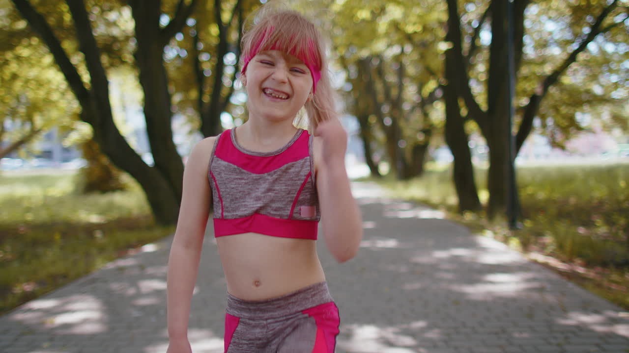 Athletic fitness runner girl kid celebrate success win scream rejoices triumph victory marathon race