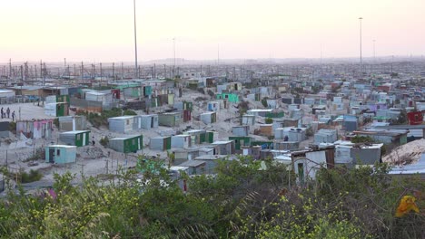 good establishing shot of the vast rural townships of south africa with tin huts slums poverty and poor people 1