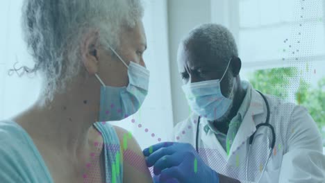 animation of data processing over african american doctor wearing face mask vaccinating patient