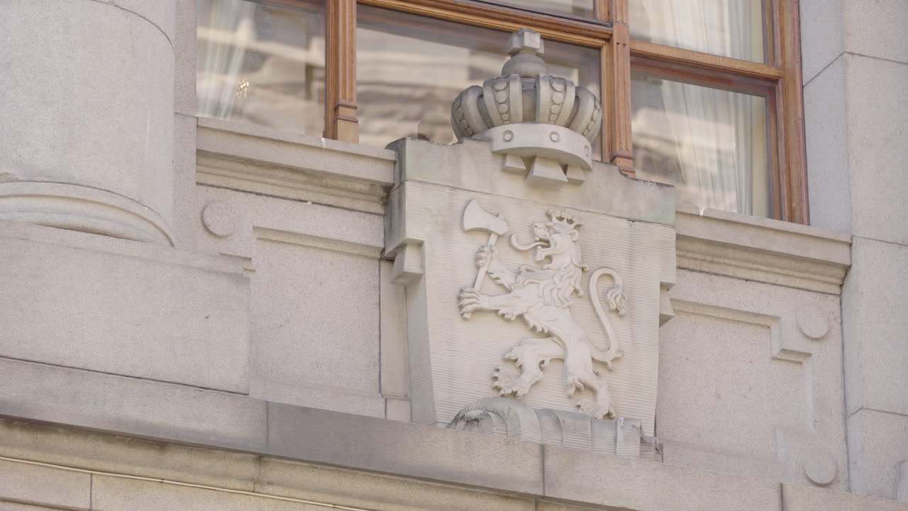 Stone Carving of a Lion with an Axe on a Building