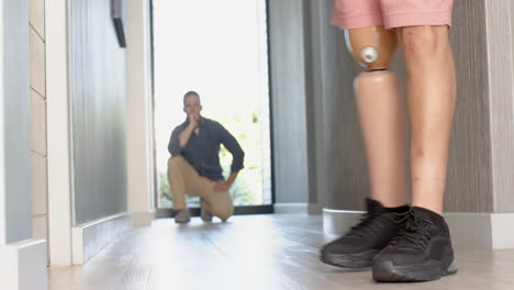 walking with prosthetic leg, person observed by therapist in hallway