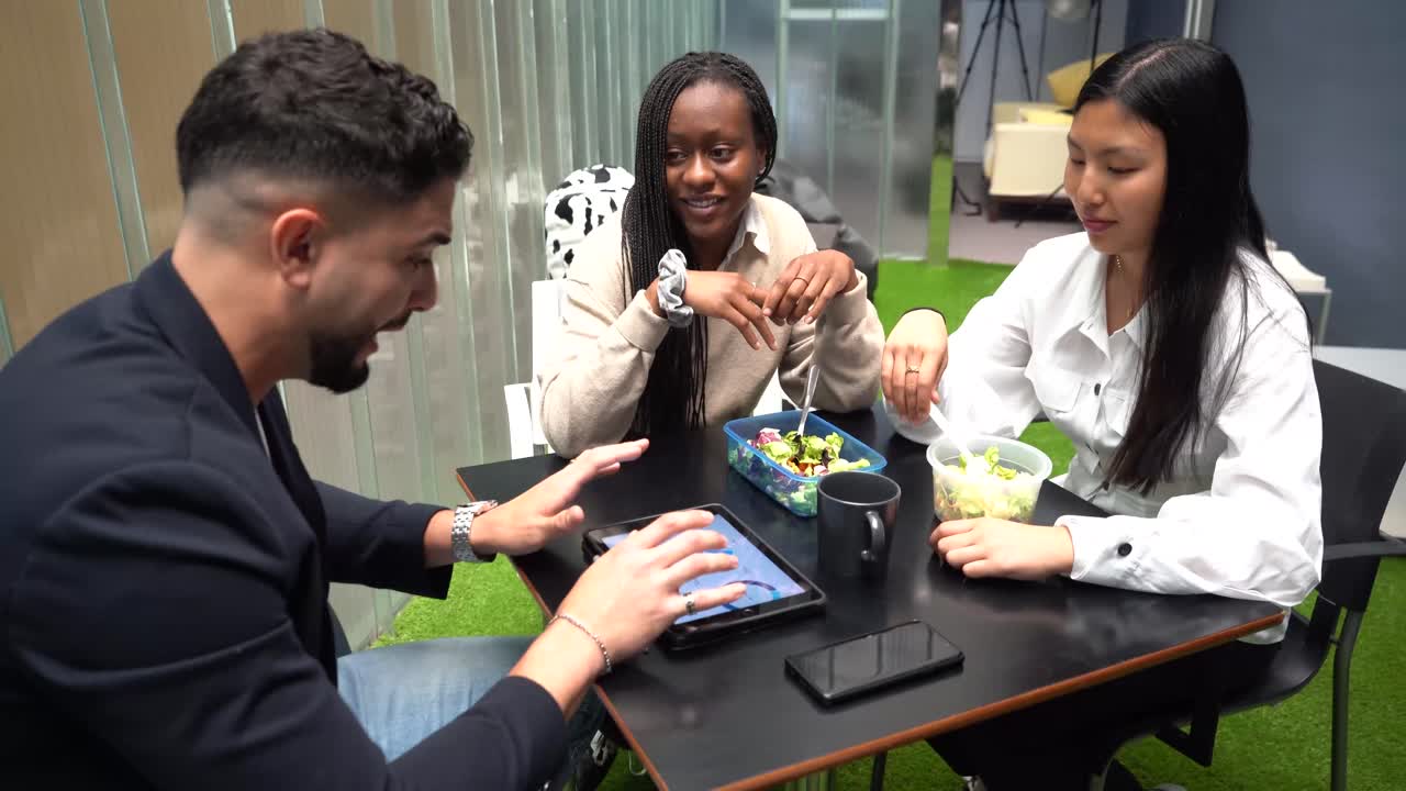 Crop diverse colleagues having lunch together