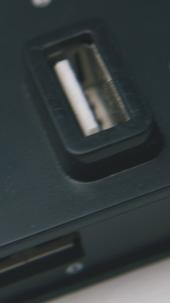 motion over modern usb hub in black plastic case on clean white background extreme close view