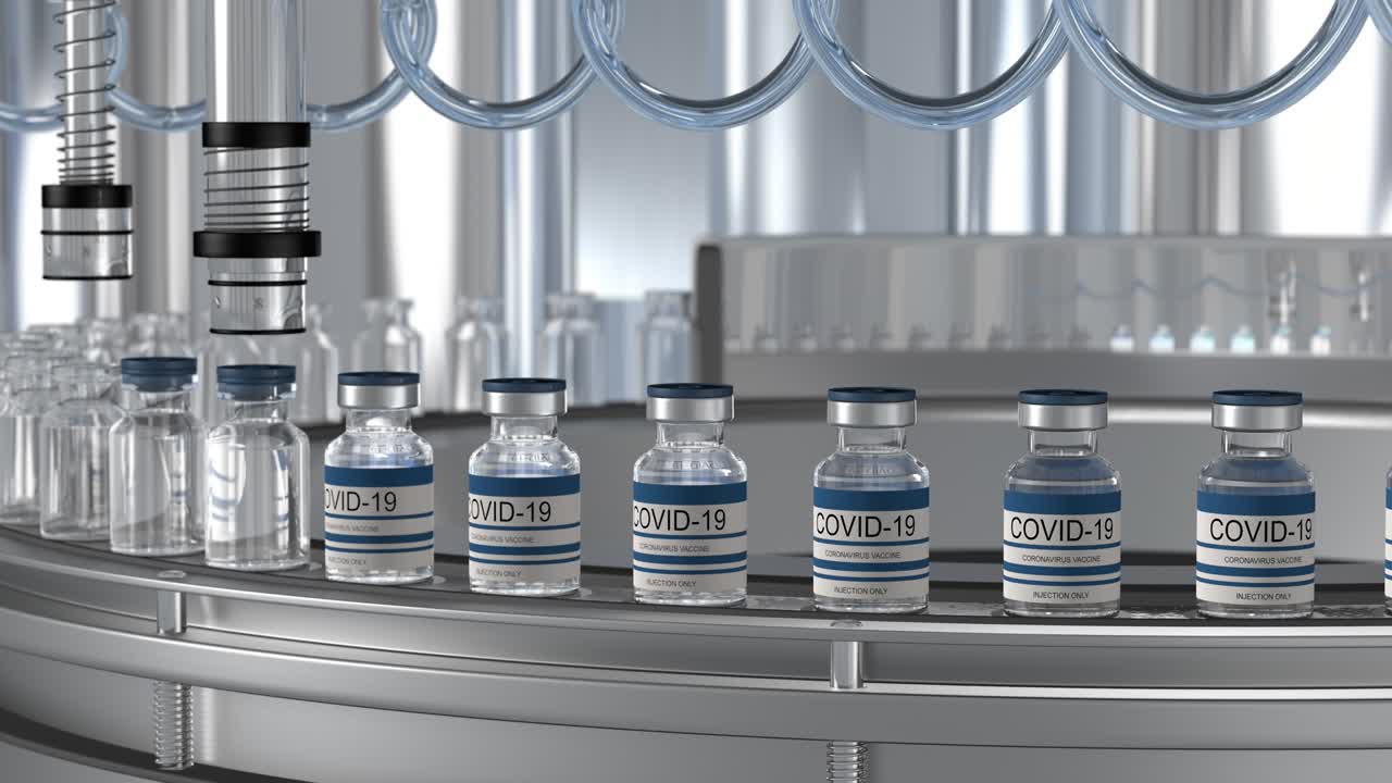 SARS-COV-2 COVID-19 Mass production of coronavirus vaccine, a machine pours the vaccine, seals bottle caps into ampoules moving along a pharmaceutical conveyor belt in a research laboratory