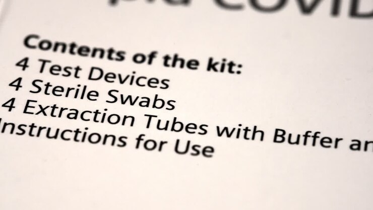 slow slider over the contents of a Covid-19 test box