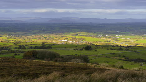 timelapse of rural nature farmland fields with hills in distance during sunny cloudy day viewed from carrowkeel in county sligo in ireland