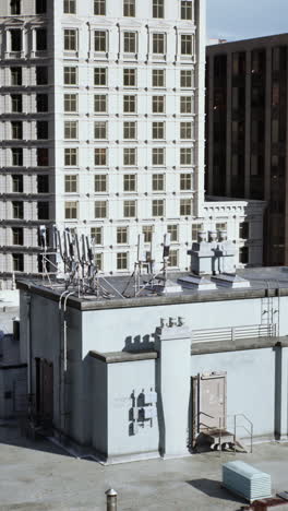 rooftop view of a city with tall buildings and a clear sky