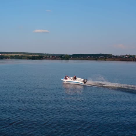motor boat sails along the river