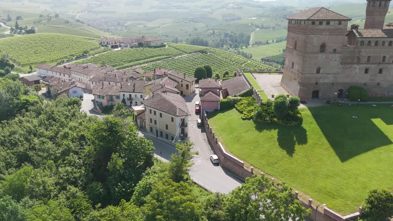 Grinzane Cavour castle, UNESCO site, Cuneo, Piedmont, Italy. 4k aerial view of the castle and the Vineyard. Langhe-Roero and Monferrato. Moving forward with castle on the right