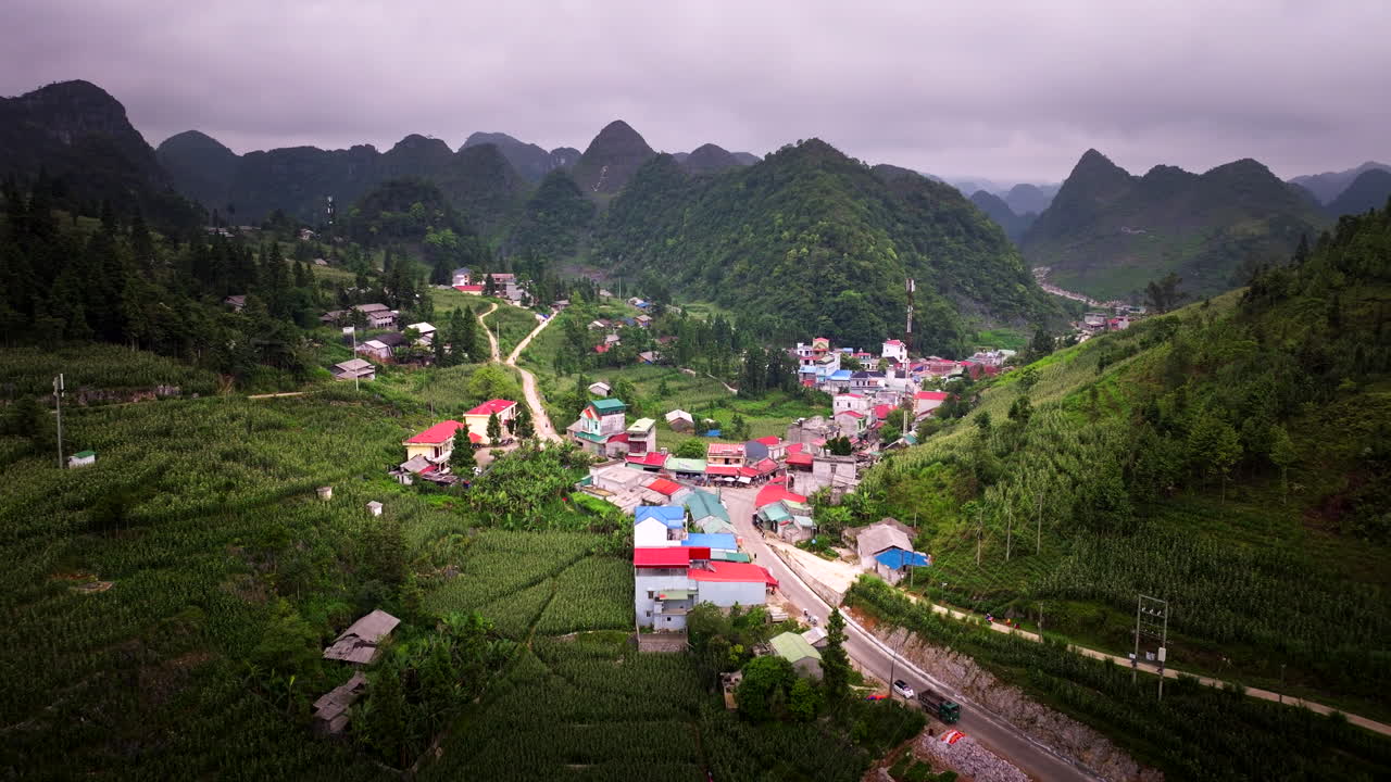 Remote Village Surrounded By Dense Mountains In Ha Giang Province, Northern Vietnam. Aerial Drone Shot