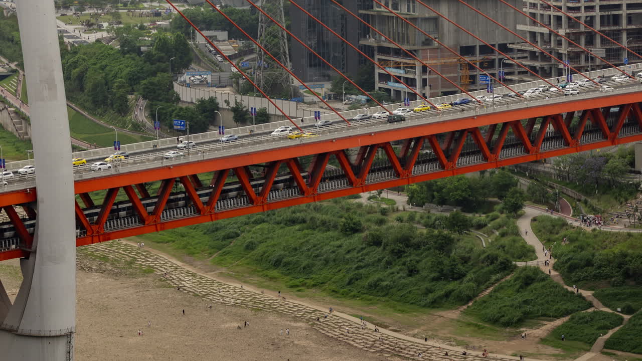 Timelapse of the amazing Chongqing cyberpunk city skyline from a high vantage point wirh the yangtze river at sunset