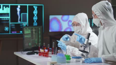 team of scientists is working on a vaccine in a modern scientific research laboratory. genetic engineer workplace. future technology and science concept
