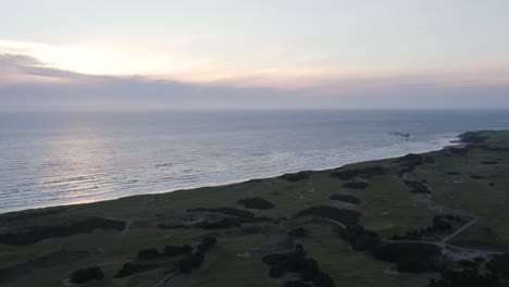 gorgeous sunset over the links at bandon dunes golf course on oregon coast