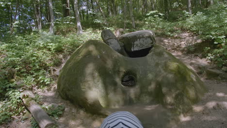 family exploring ancient megalithic site in forest