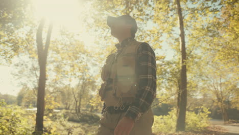 fisherman in autumn woods
