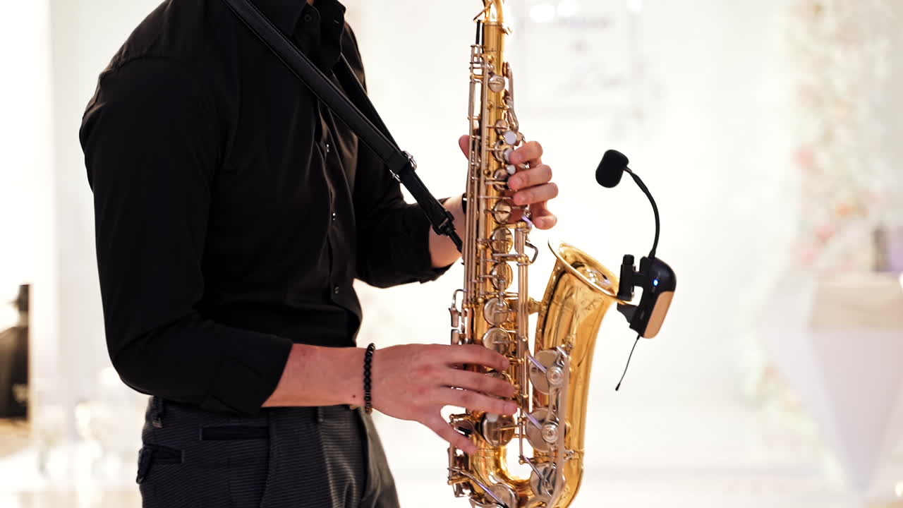 Saxophonist playing jazz music. Music instrument played by saxophonist player musician