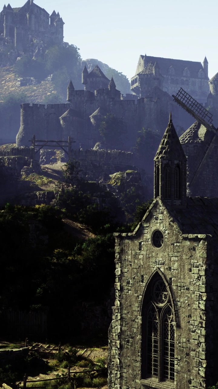 Vecchia chiesa e castello su una montagna di giorno con un mulino a vento nelle vicinanze