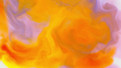 pink and yellow paint or dye dropped into water against white background to create swirling colourful smoke background