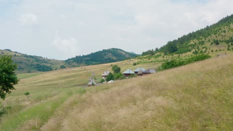 Small-houses-in-the-peaceful-village-Ticje-polje-surrounded-by-greenery-,Jadovnik-Mountain,-Prijepolje,-Serbia