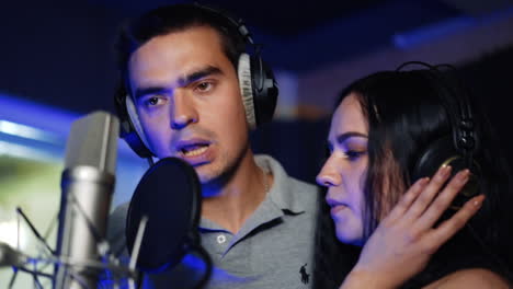couple singing in a recording studio