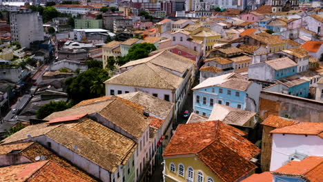 aerial view of the houses and buildings on the pelourinho neigbourhood and some people walking around, salvador, bahia, brazil