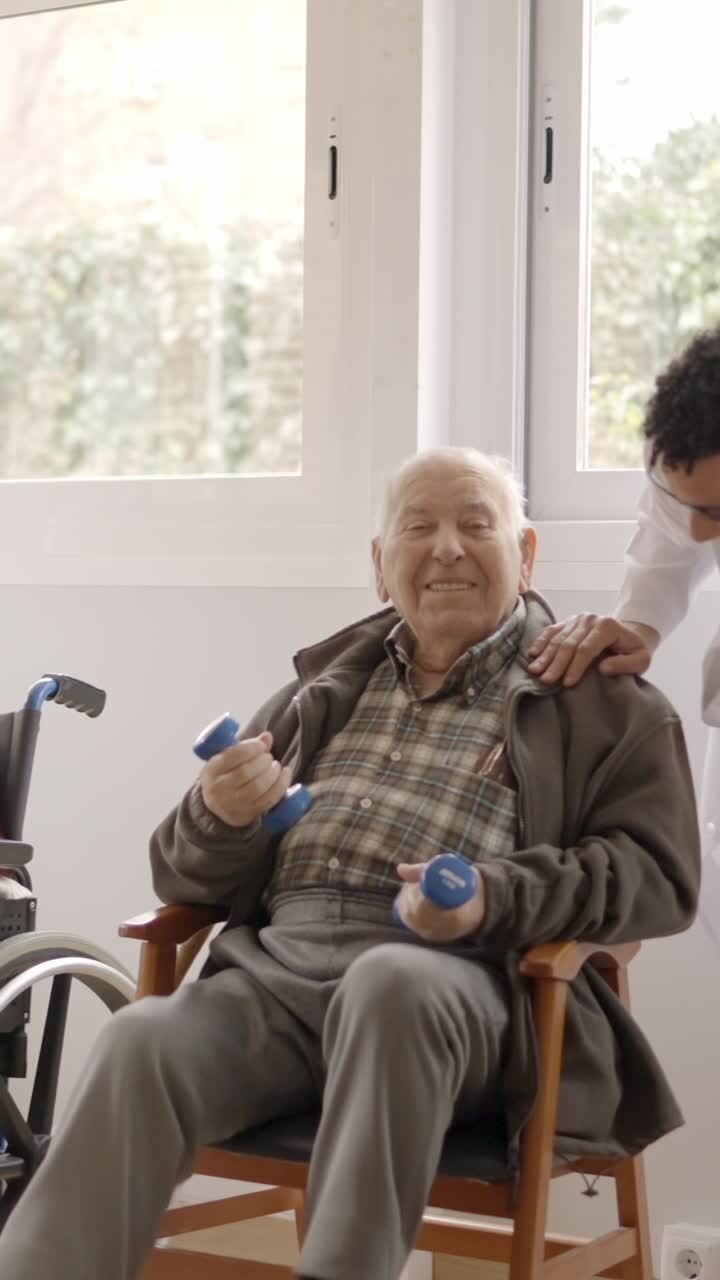 Physiotherapists talking to senior people while exercising in geriatrics