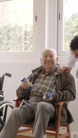 physiotherapists talking to senior people while exercising in geriatrics