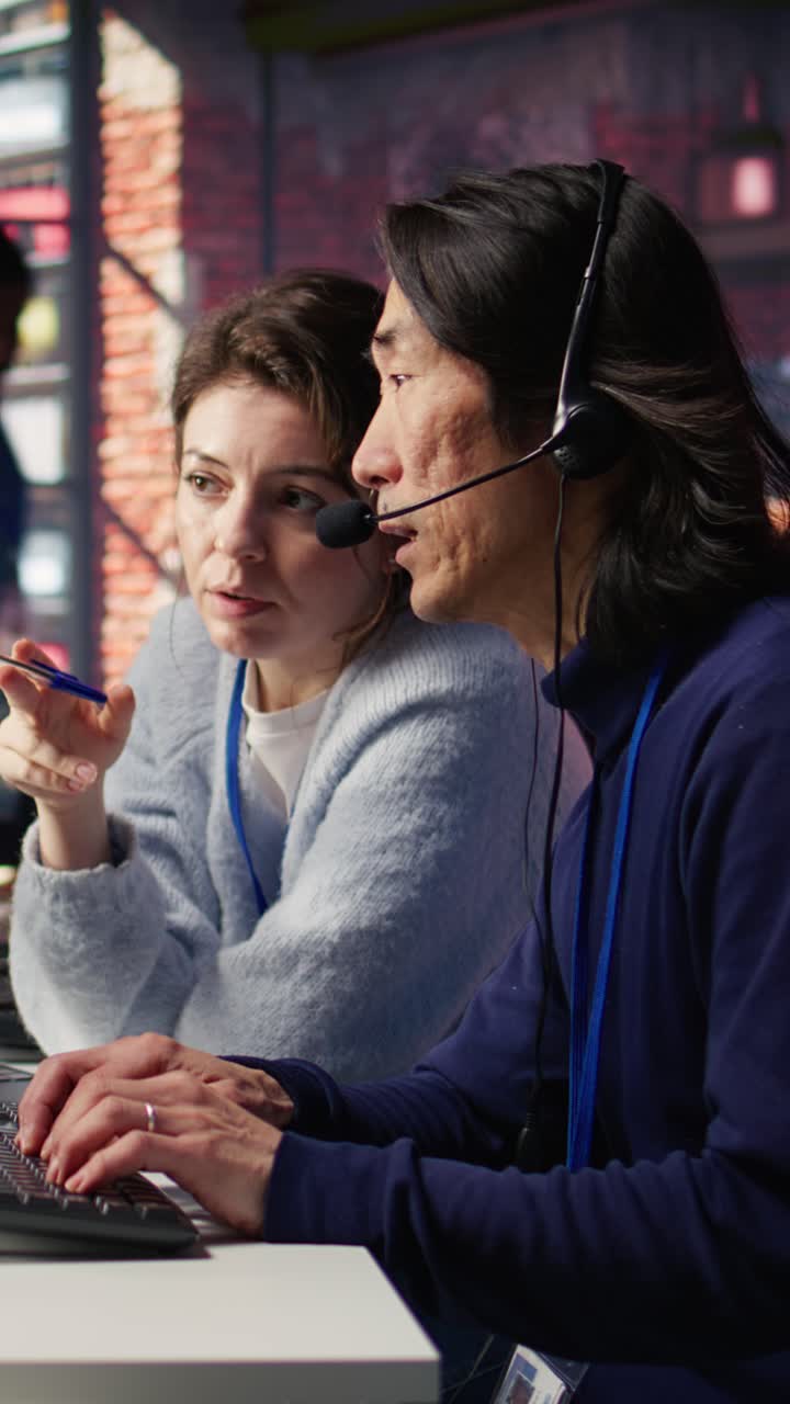 Vertical video Call center team leader supervising agent helping customers