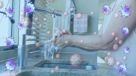 Animation-of-purple-virus-cells-over-hands-pf-caucasian-senior-man-washing-hands