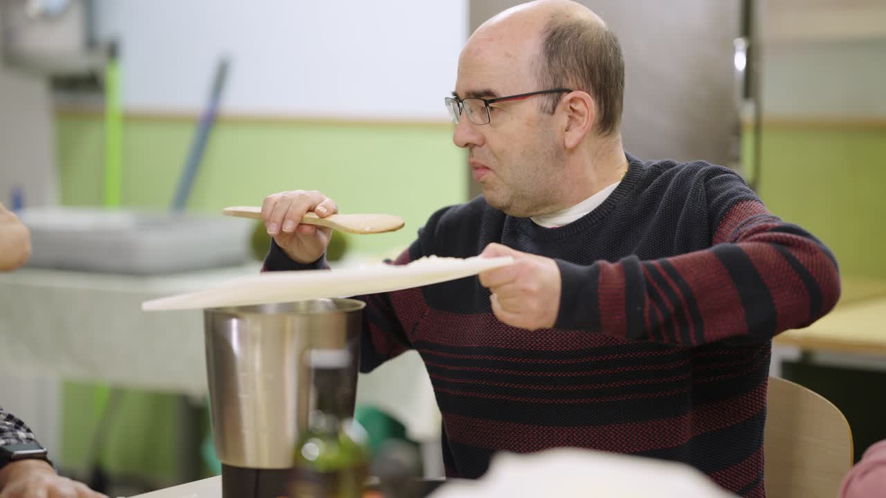 A man cooking food indoors