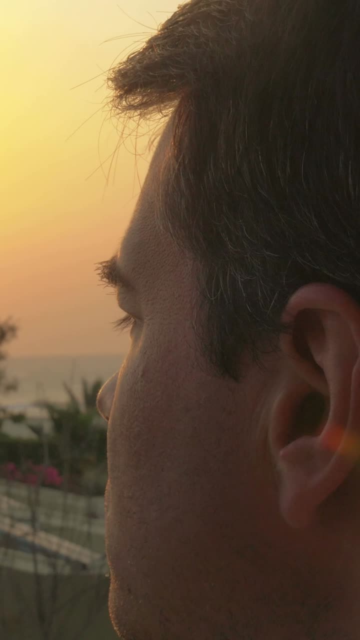 Man with Glasses at Sunset